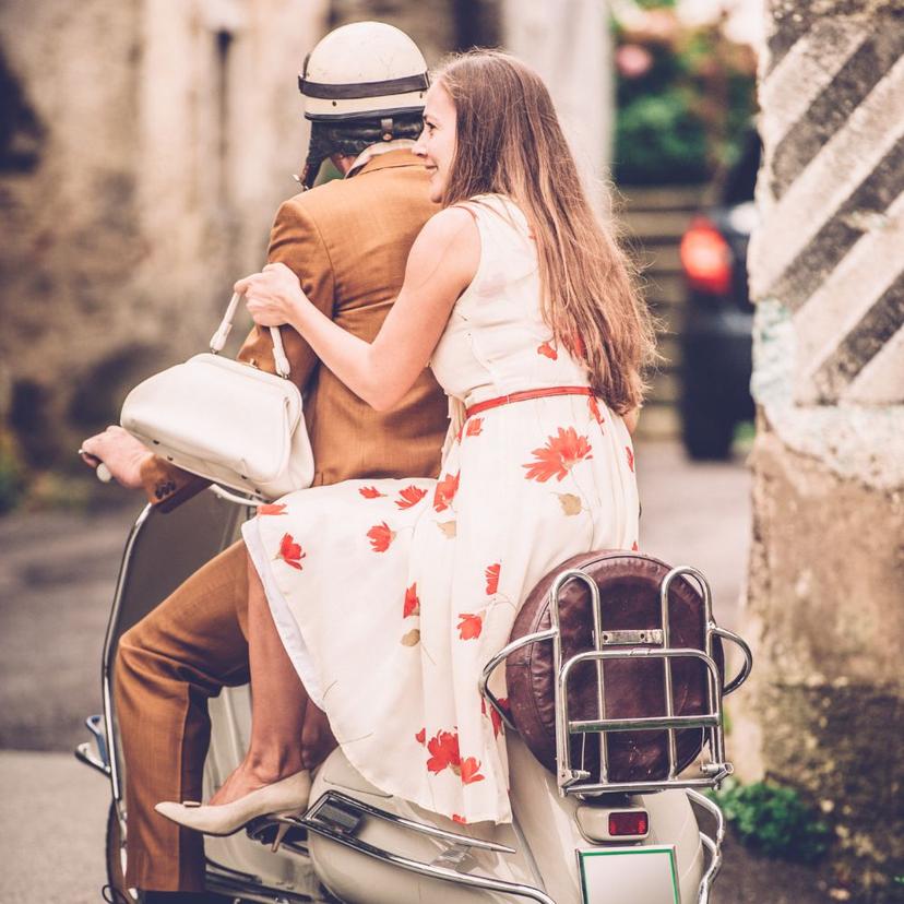 A couple on a Vespa in Rome