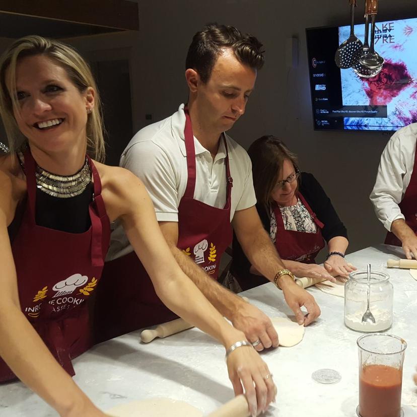 A group of people having fun in the Pizza Making Class in Rome