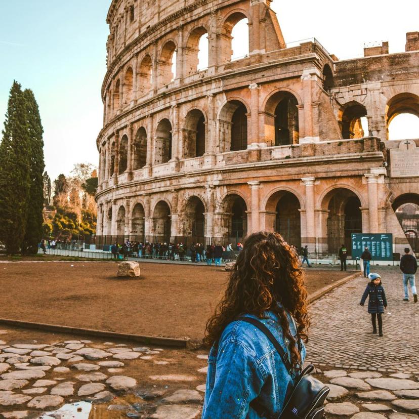 Woman in front of Colosseum for a Tour