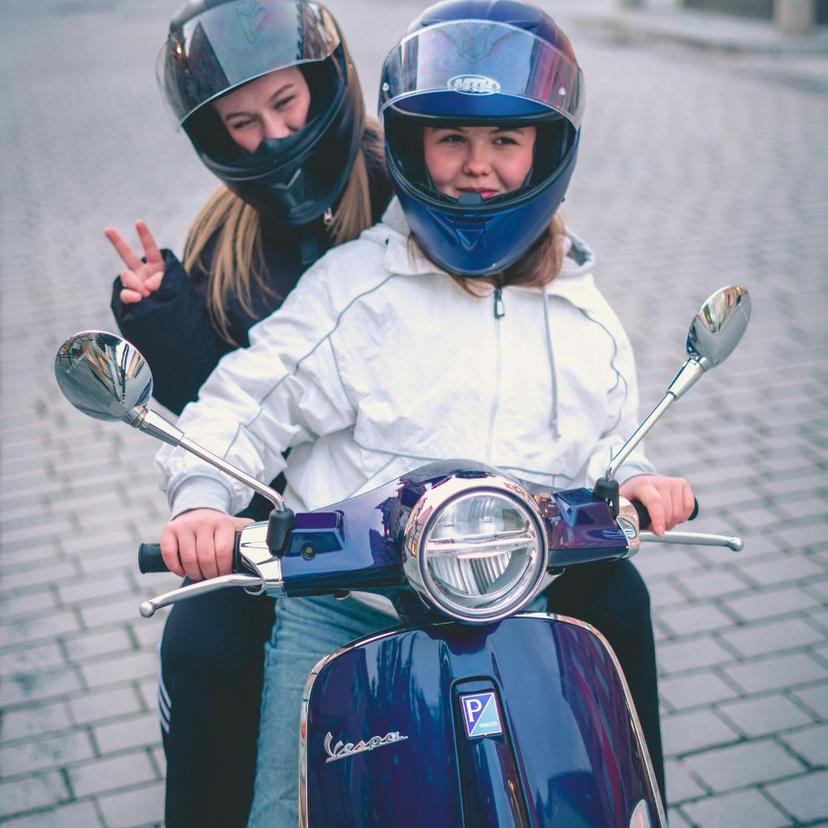 Mother and child with a Vespa in Roma