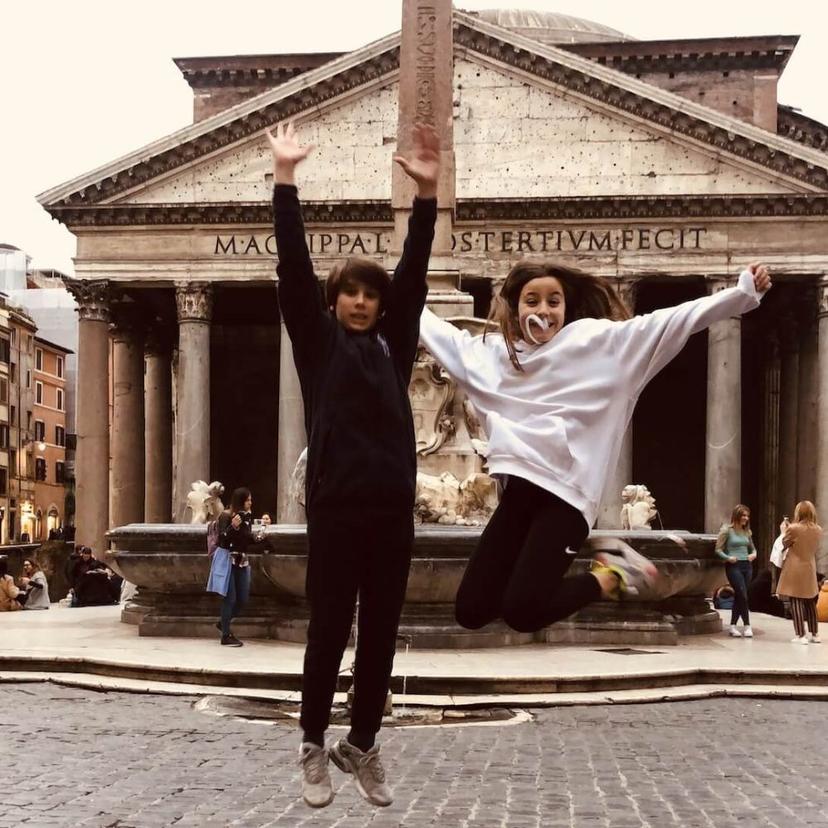 Kids enjoying treasure hunt in Rome, discovering landmarks