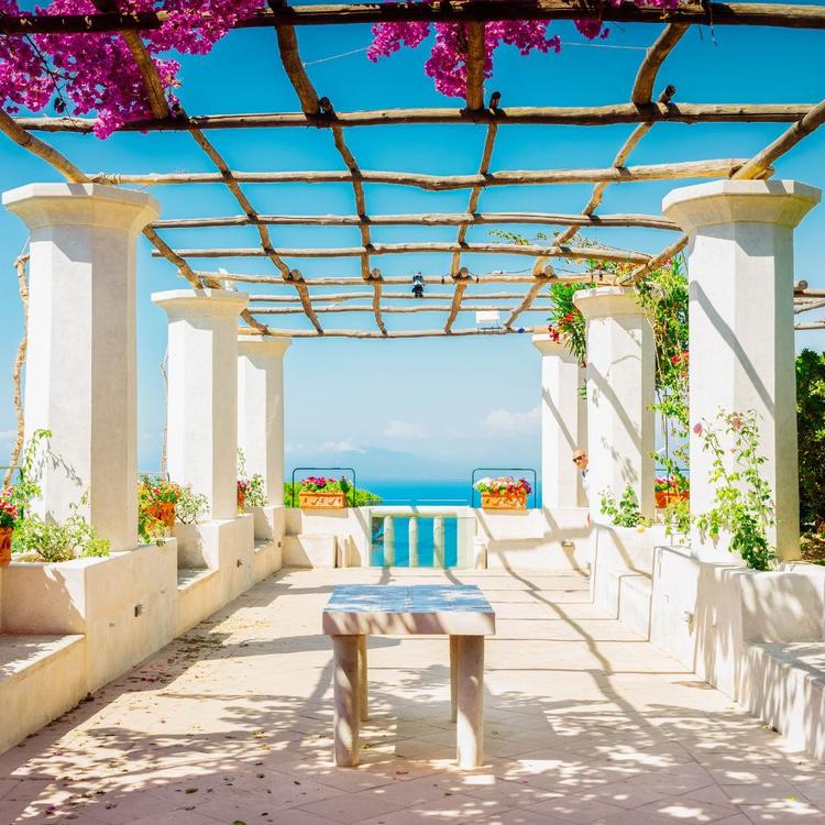 Terrace with sea view and flowers overlooking the Amalfi Coast in Italy