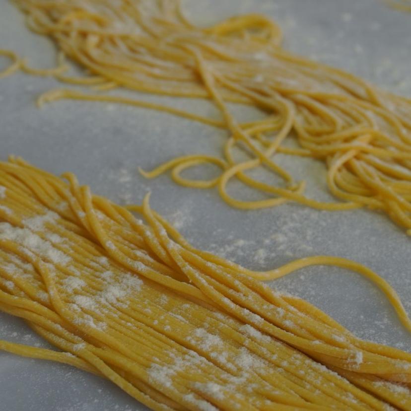 Raw Pasta on parchment with flour