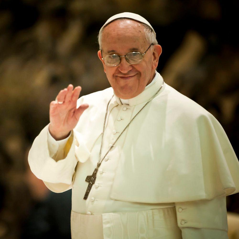 Pope Francis wave at crowd during papal mess