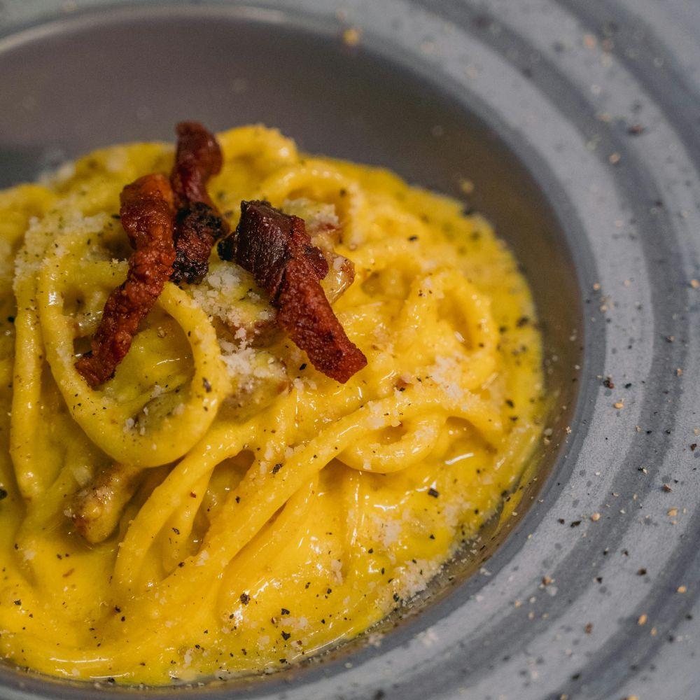 Authentic Roman carbonara pasta made with guanciale, eggs and pecorino romano