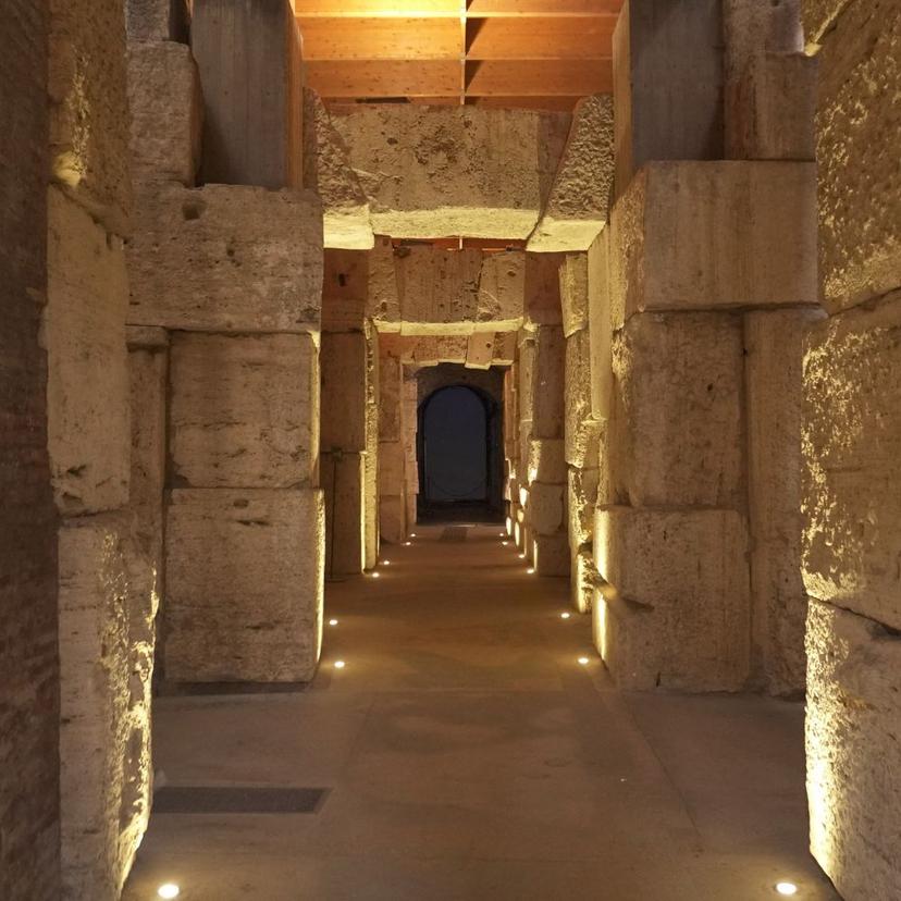 Illuminated corridor along the Colosseum Underground path on a VIP tour with special access