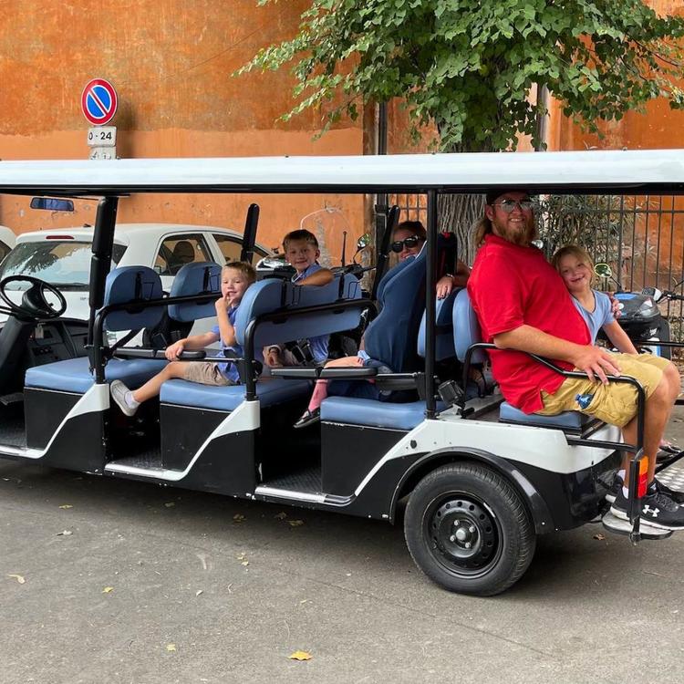 Family enjoying golf cart tour