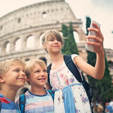 kids-taking-a-selfie-in-front-of-the-colosseum-during-a-tour-with-walks-inside-rome Kids taking a selfie in front of the Colosseum during a Walks Inside Rome Tour